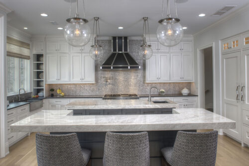 This is a picture of the unique silver and grey backsplash from a kitchen featuring custom cabinetry from Kountry Kraft Cabinetry. 