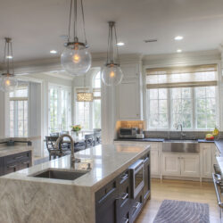 This is a picture of a silver and white themed kitchen featuring custom cabinetry from Kountry Kraft Cabinetry.