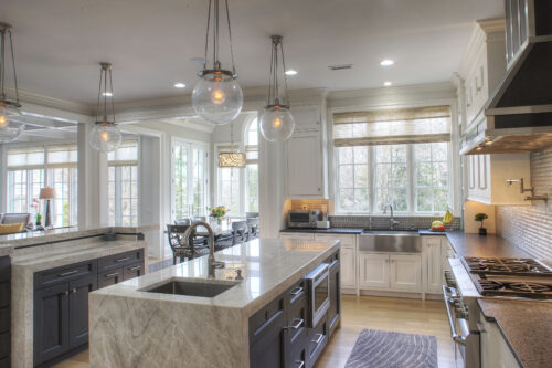 This is a picture of a silver and white themed kitchen featuring custom cabinetry from Kountry Kraft Cabinetry.