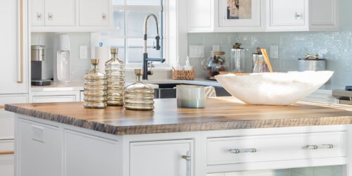 This is a picture of the Corian Calcatta Villa countertop in a kitchen with custom made cabinetry by Kountry Kraft Cabinetry.