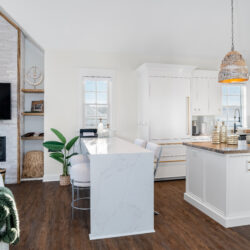 This is a picture of a bright and white kitchen made with custom cabinetry by Kountry Kraft Custom Cabinetry.