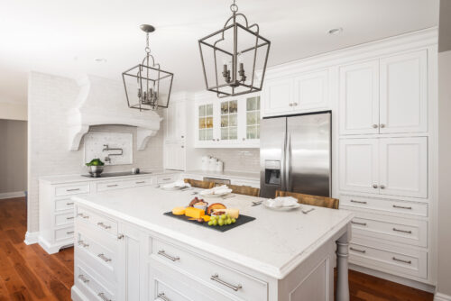 This a picture of a white kitchen in Cranberry Township Pennsylvania with custom cabinets by Kountry Kraft Cabinetry. 