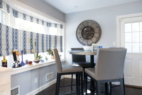 This is a picture of the small yet open dining area from a kitchen in Great Neck New York with custom made cabinetry by Kountry Kraft Cabinetry. 