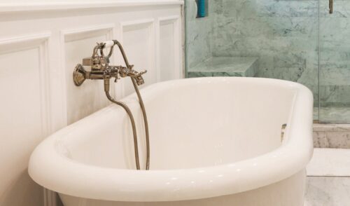 This is a picture of a white free-standing chromatherapy tub from a bathroom in Point Lookout New York. 