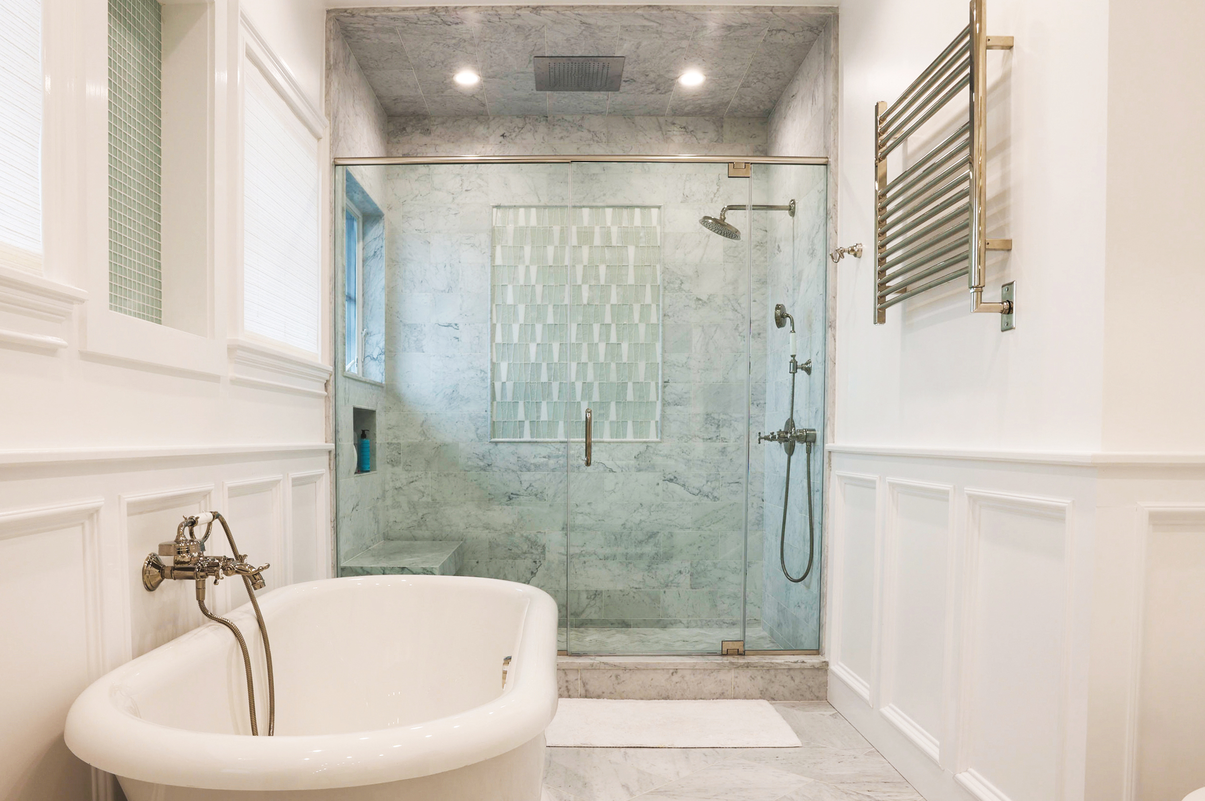 This is a picture of a white bathroom in Point Lookout New York with custom made cabinets by Kountry Kraft Cabinetry.