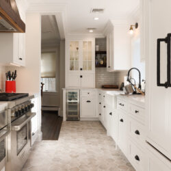 This is a white kitchen with custom cabinets made by Kountry Kraft Cabinetry.