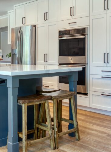 This is a picture of the double oven and refrigerator from a kitchen in Walnut Creek California. 