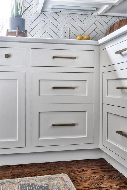 Alpine White Painted Inset No Bead Cabinets with Brass Hardware in Montvale, New Jersey