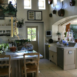 This is a picture of a unique and rustic kitchen in Orange California with custom cabinetry by Kountry Kraft Cabinetry.