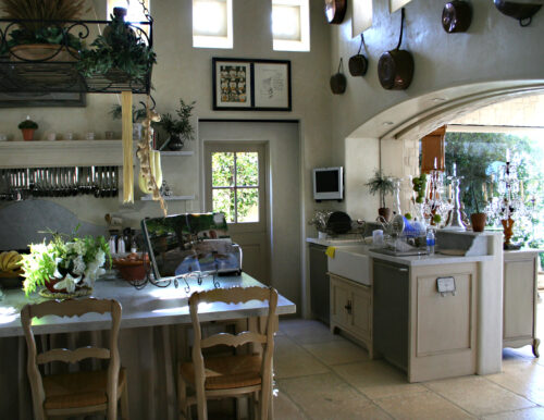 This is a picture of a unique and rustic kitchen in Orange California with custom cabinetry by Kountry Kraft Cabinetry.