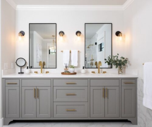 Bathrrom remodel in Lafayette California with Gray cabinets gold hardware marble floors and a valet in the hallway prior