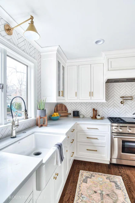 Custom Cabinets painted Alpine White with Brass Hardware in Montvale, New Jersey