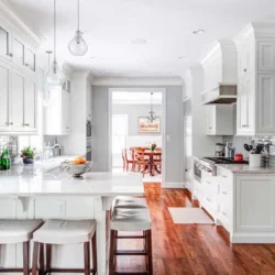 Five stools under an L-shaped counter and hard maple cabinets Madison, New Jersey