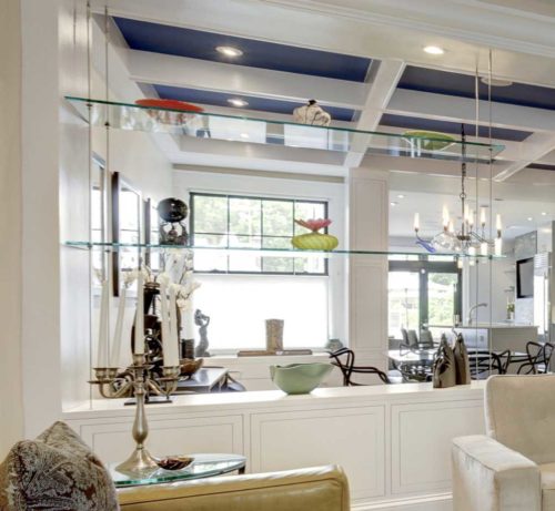 Custom Cabinets Design featuring a glass shelves serves as a room divider