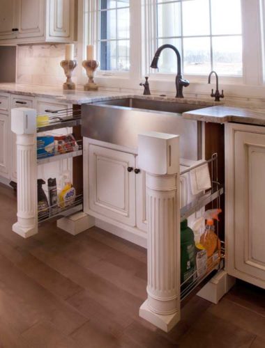Pull Out Cleaning Rack and Other Custom Storage Options Are Used in this traditional Kitchen Design