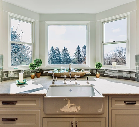 Farmhouse sink looking out pushed-out windows in NJ