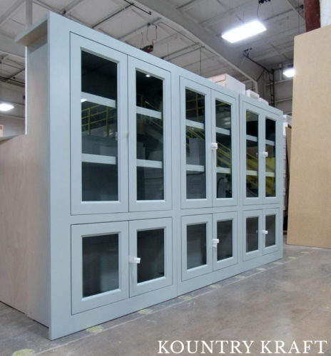 This Butler’s Pantry is Finished with Light Shade of Blue Cabinet Color with Glass Doors