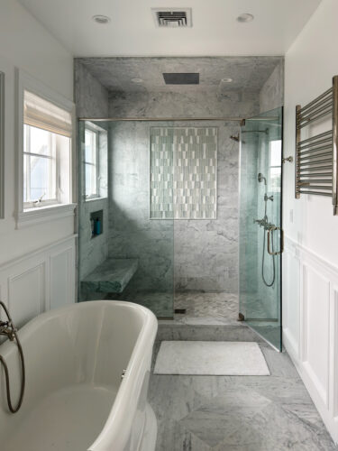 This is a picture of a grayscale bathroom in Point Lookout New York with custom made cabinets by Kountry Kraft Cabinetry. 