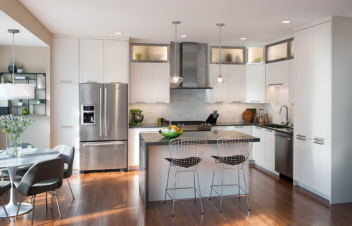 This kitchen features an L Shaped Kitchen Layout that Provides Extra Seating and Storage 