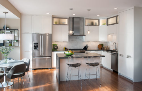 This kitchen features an L Shaped Kitchen Layout that Provides Extra Seating and Storage