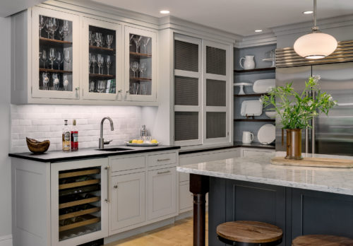 Custom Crafted Cabinets with Floating Shelves and by Pass Doors Featured in this Kitchen