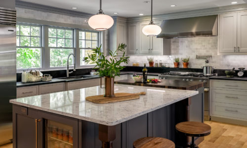 Large Kitchen Islands Featuring Ample Amount of Seating and a Mini Fridge