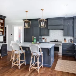 Kitchen featuring island, chairs, range, and L-shaped counter Summit, NJ