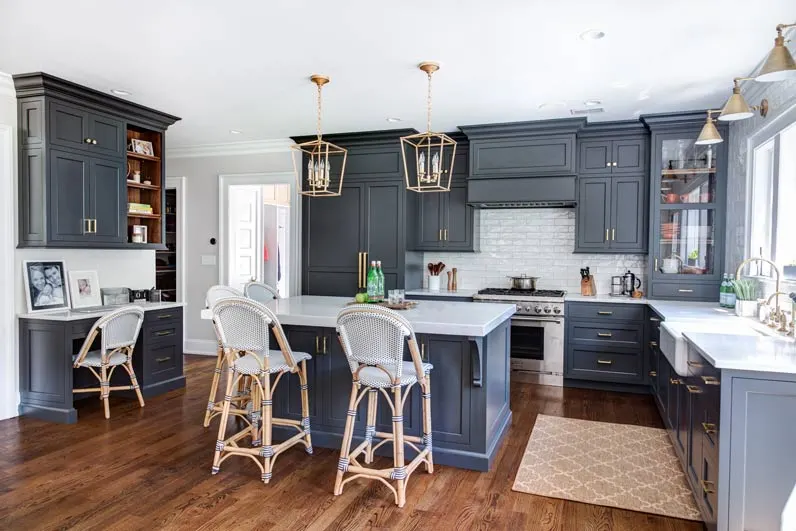 Kitchen featuring island, chairs, range, and L-shaped counter Summit, NJ