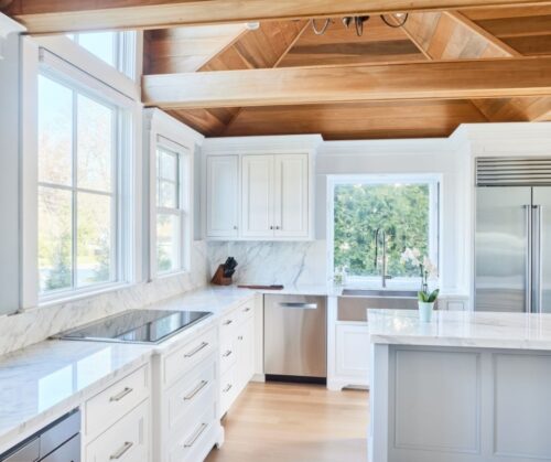 Kitchen remodel in clinton Ct with white cabinets and a wood ceiling