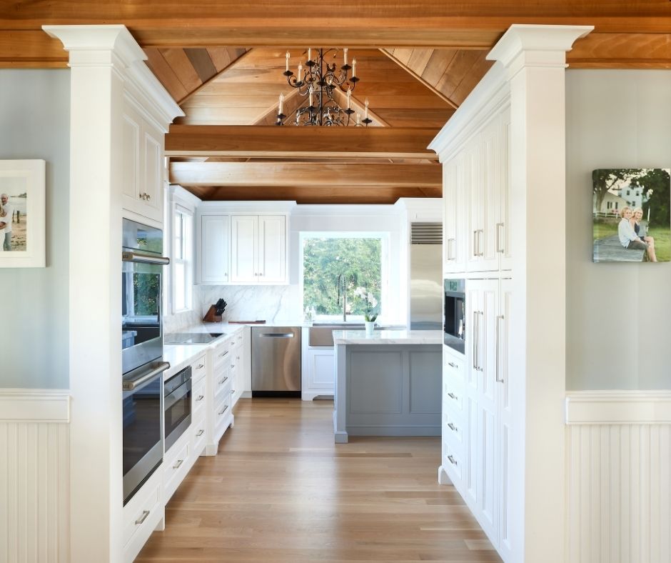 Kitchen remodel in clinton Ct with white cabinets and a wood ceiling
