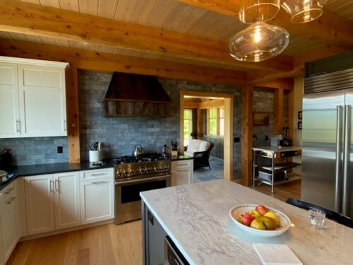Kitchen-and-Bath Remodel-in-White Mountains- New Hampshire kitchen with wood beam ceiling and wolf range