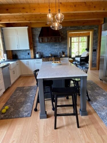 Kitchen-and-Bath Remodel-in-White Mountains- New Hampshire kitchen with blue island and white perimeter countertops