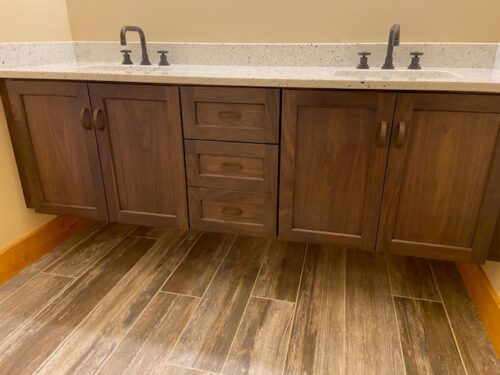 Kitchen-and-Bath Remodel-in-White Mountains- New Hampshire- Brown vanity cabinet and wood floor