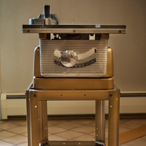 Original Sears Craftsman Table Saw used by Kountry Kraft Custom Cabinetry still stands in showroom lobby today