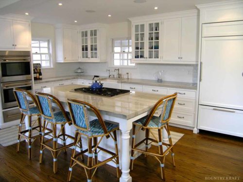 White L-shaped kitchen with island, ovens, and panel refrigerator Greenwich, CT