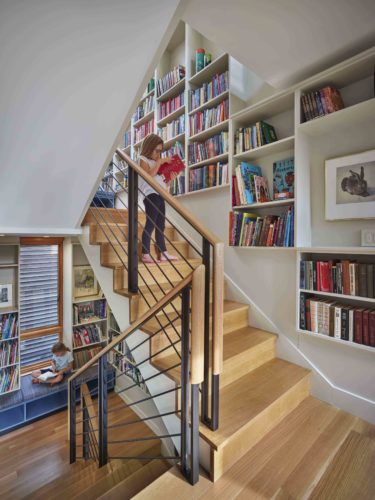 Vertical Library featuring Bookcase Bench Cabinets Acting as Office Cabinets to keep Books and Toys Organized
