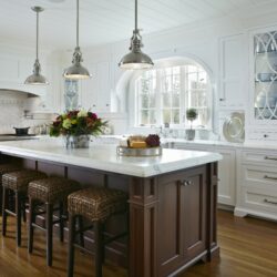 this is a picture of a white-themed kitchen with custom cabinet and storage by Kountry Kraft Custom Cabinetry.