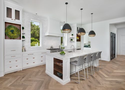 This Kitchen Features a Single Wall Kitchen Layout that Creates an Open Space for this Home