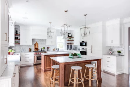 Two kitchen islands with natural marble Carrara countertops for a kitchen located in Madison, New Jersey