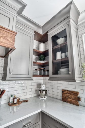 This Kitchen Features open shelving which is a Current Kitchen Cabinet Trend