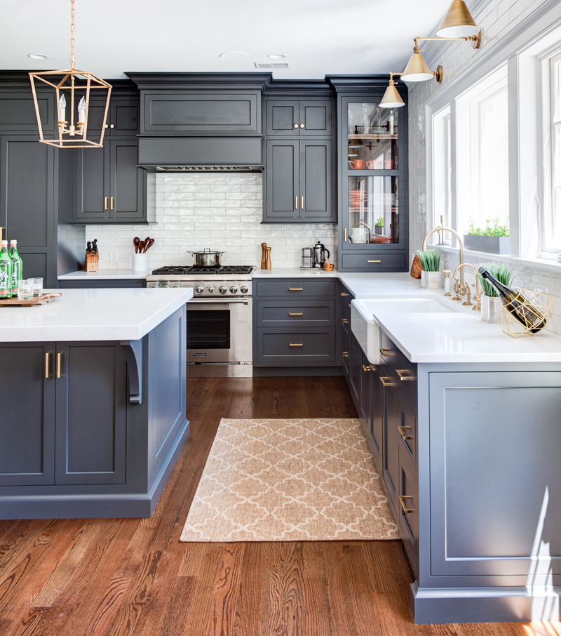 Navy Colored Cabinets by Kountry Kraft with Brass Hardware and White Countertops 