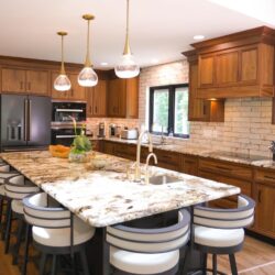 This is a picture of a custom-made walnut wood kitchen from Kountry Kraft Custom Cabinetry.