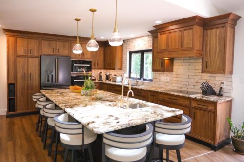 This is a picture of a custom-made walnut wood kitchen from Kountry Kraft Custom Cabinetry.