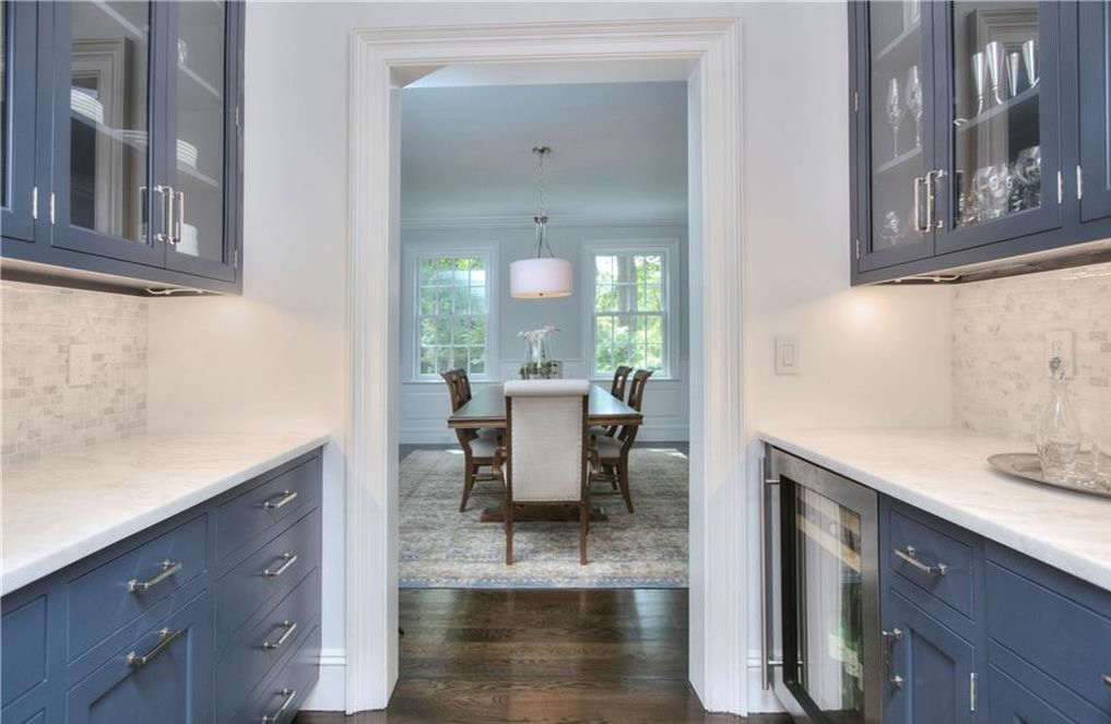 Hale Navy Blue Cabinets for a Butler's Pantry with White Countertops and Silver Hardware