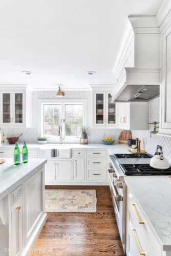 White Kitchen in New Jersey with Chevron Tile Backsplash White Countertops Wood Floors