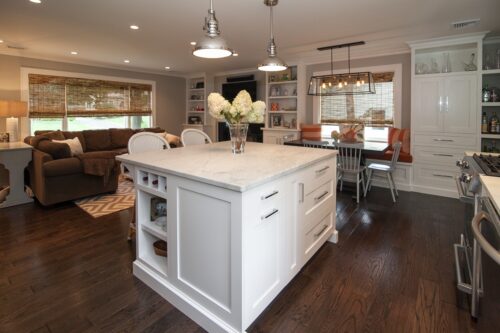 This is a picture of an overview of the standing white countertop island with custom made cabinetry by Kountry Kraft Cabinetry.
