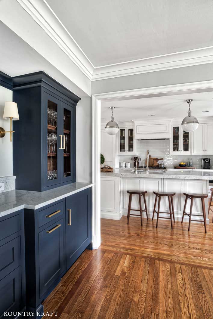 Hale Navy Dining Room Cabinetry with Brass hardware and Walnut shelves in Summit, NJ