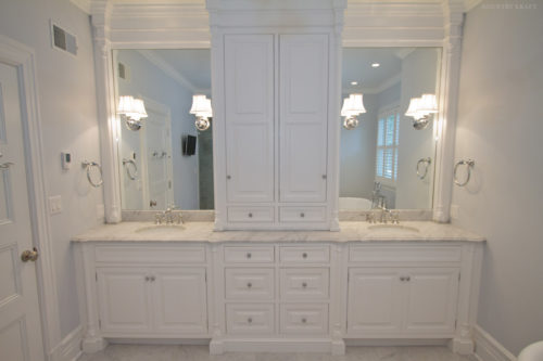 Double sink vanity with white bathroom cabinets and marble countertops North Haledon, NJ