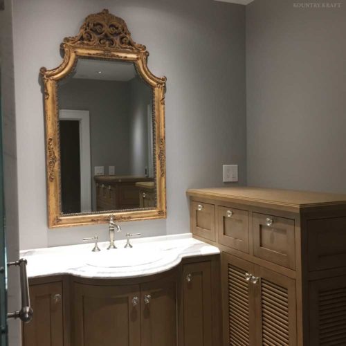 Sink, mirror and Alder wood bathroom cabinets