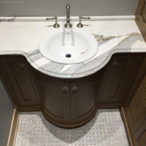 Close up of bathroom sink over Alder wood cabinets Pittsburgh, PA